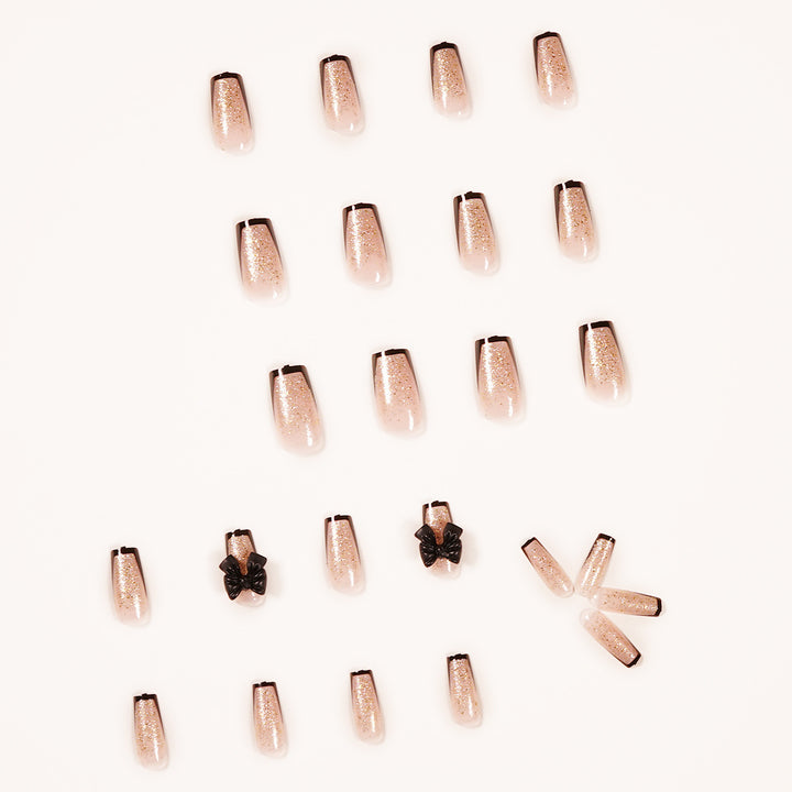 Artistic Nail Extensions with Glitter and Bow Accents Kalsten