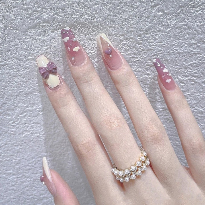Artificial nails with elegant bow accents and pearl decorations Kalsten