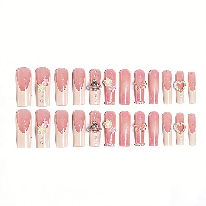 Artful nail tips with pearl and bow motifs Kalsten