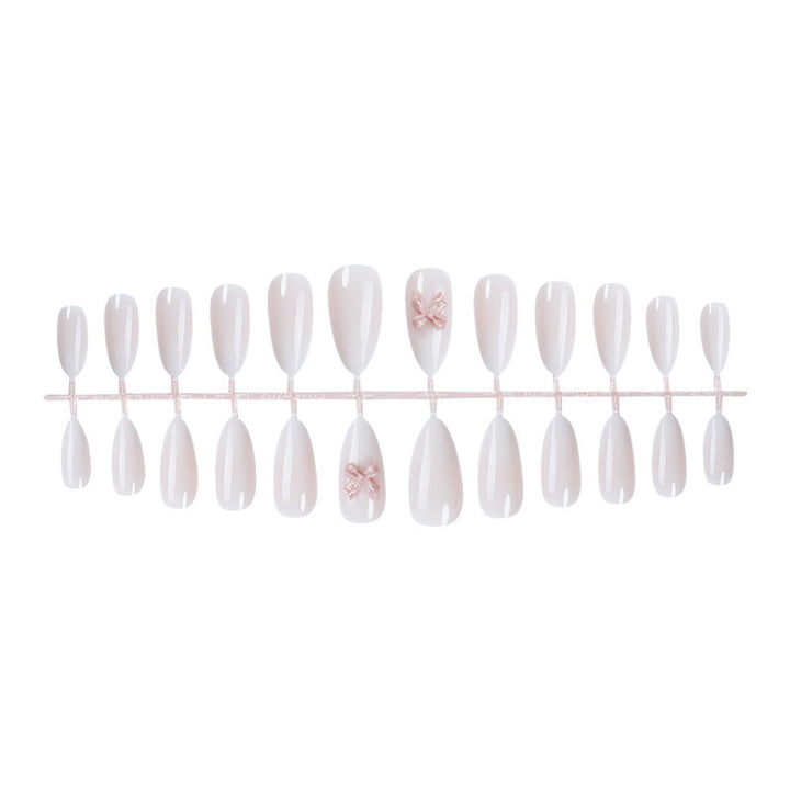Elegant artificial nail set with luxurious ombre effect and delicate bow accents Kalsten