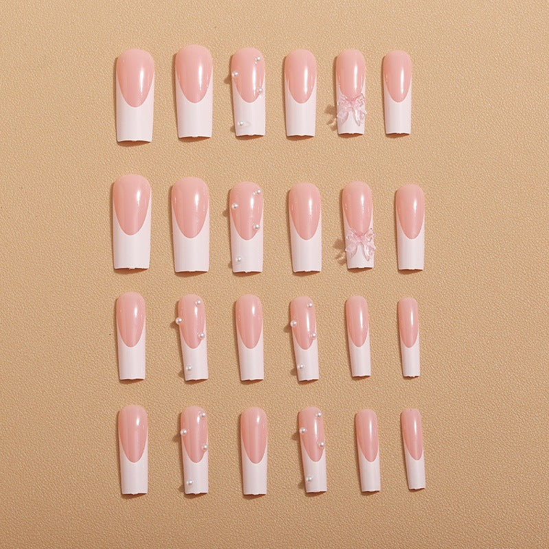 Artistic nail extensions with pearls and bows decorations Kalsten