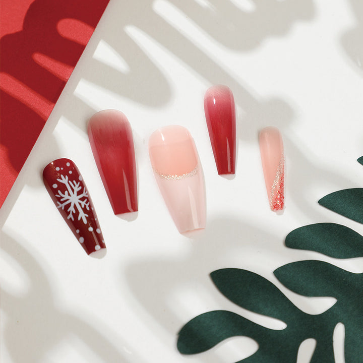 Artful Christmas nail extensions with elegant glitter and snowflake design Kalsten