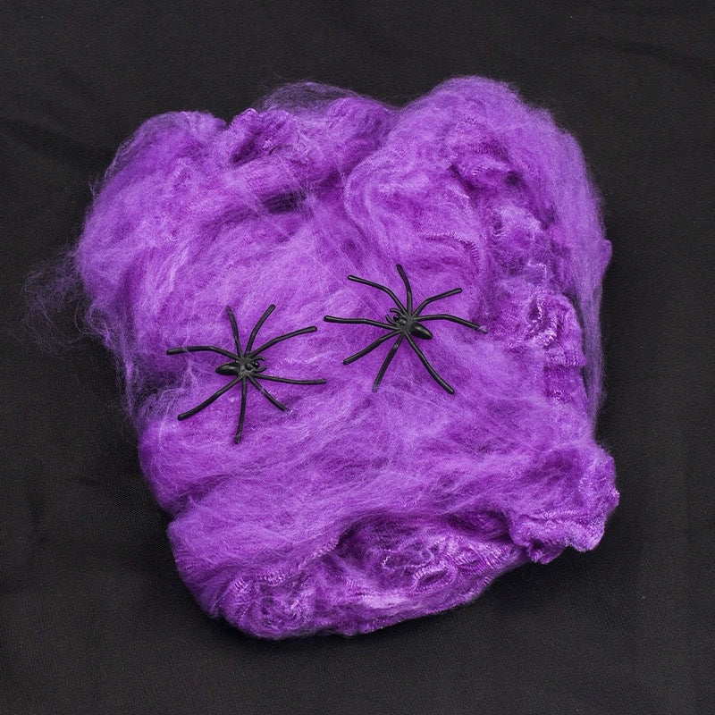 Decorative Halloween spider web with artificial spiders