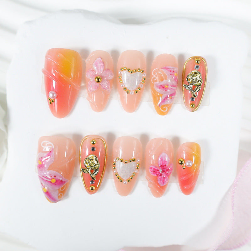 Artificial nail set with delicate flower designs and glamorous accents Kalsten