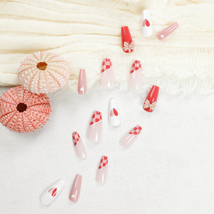 Artful nail extensions with playful designs and romantic accents Kalsten