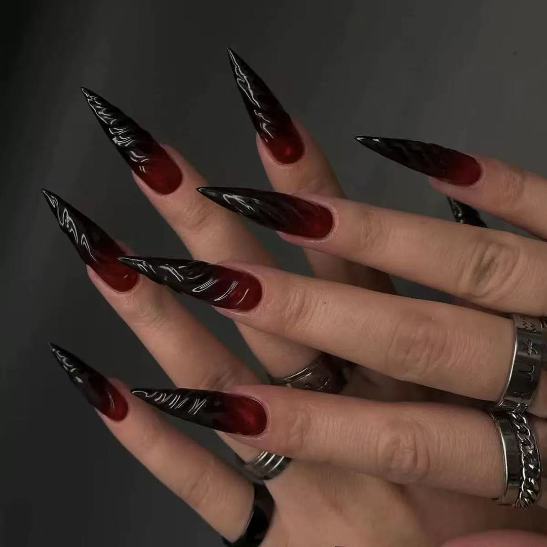 Gothic-style artificial nails with pointed tips and shiny surface Kalsten