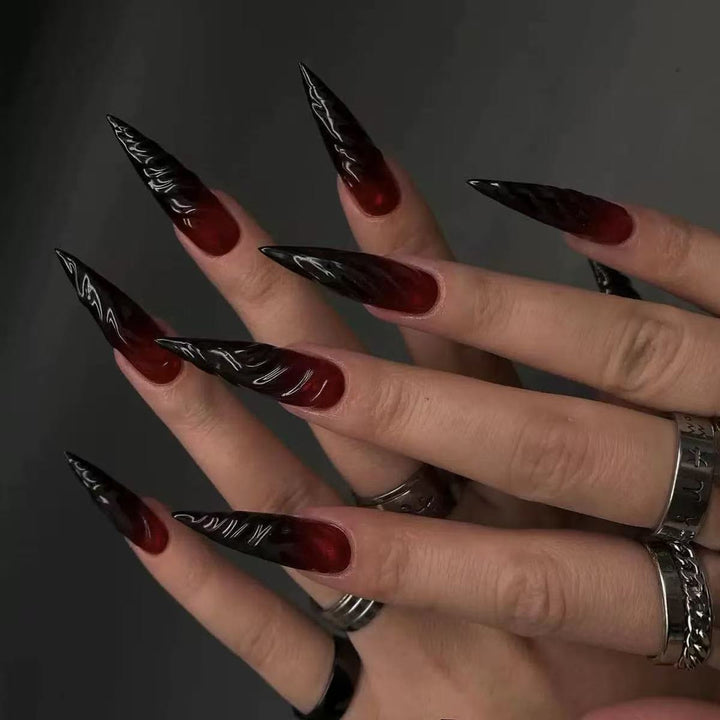 Gothic-style artificial nails with pointed tips and shiny surface Kalsten
