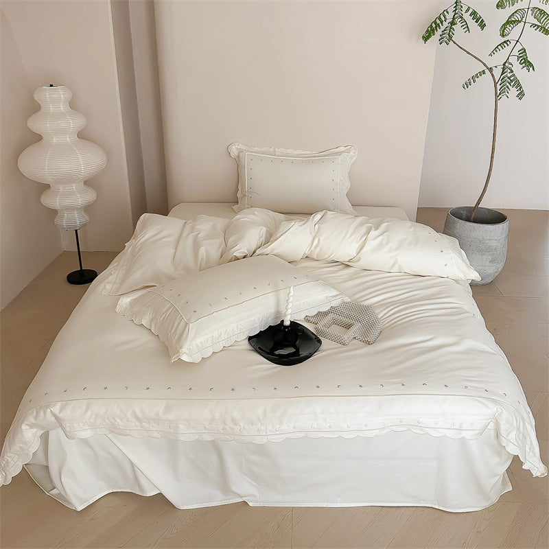 Bedding set made of cotton satin with fine star embroidery and wave hem