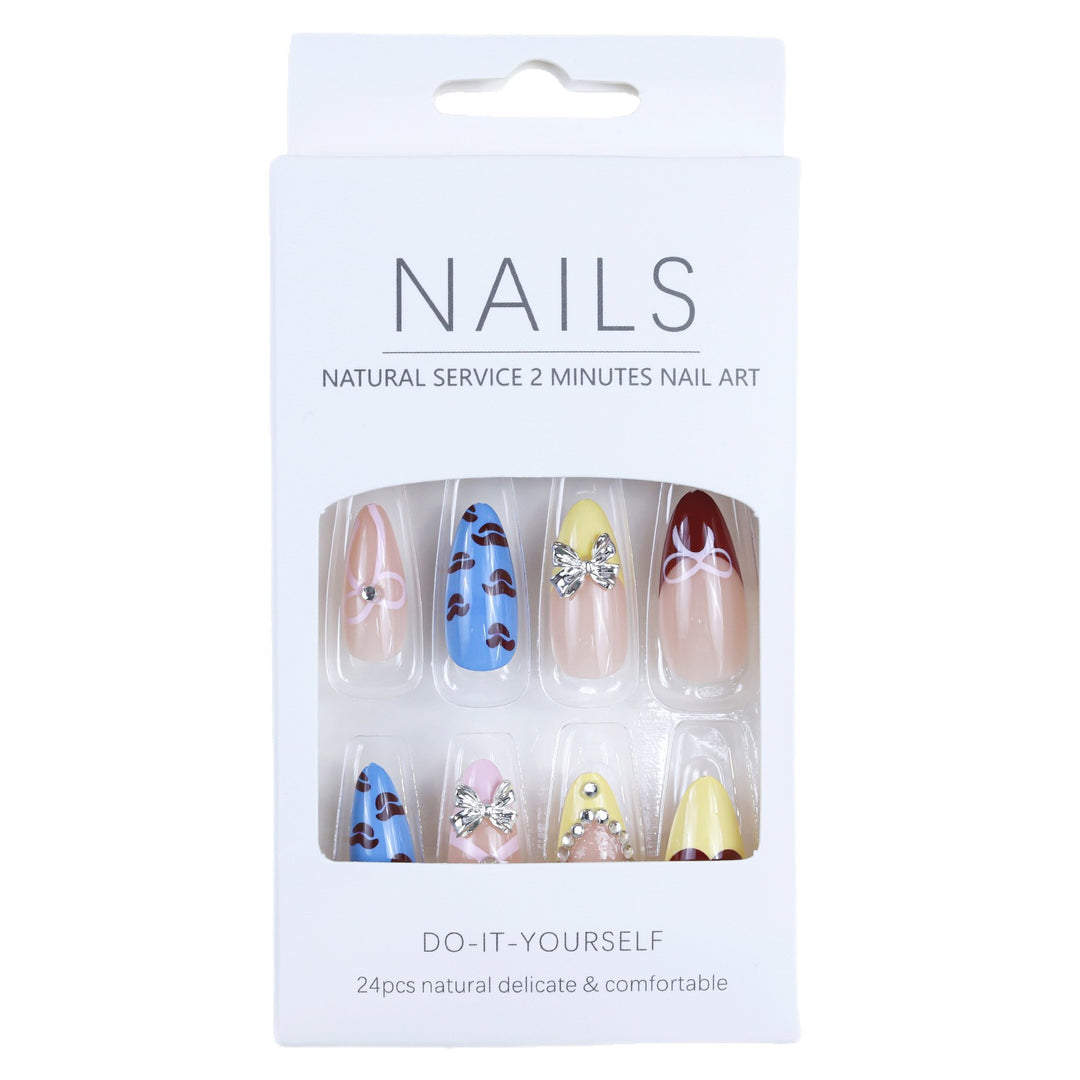 Artificial nails with playful design and 3D embellishments Kalsten