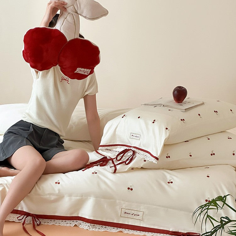 Romantic cotton satin duvet cover set with embroidered cherries, lace trim, and ties