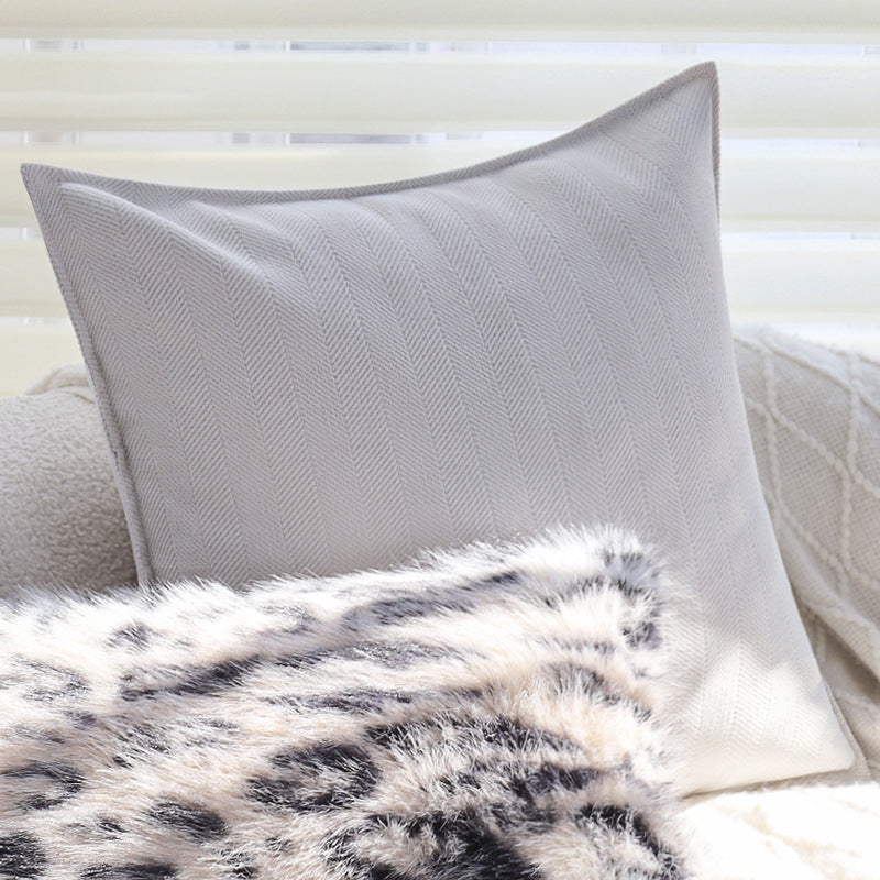 Set of square cushion covers with faux fur leopard pattern and woven herringbone look Kalsten