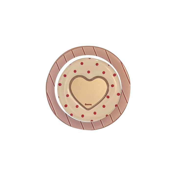 Heart-shaped coaster with playful design Kalsten