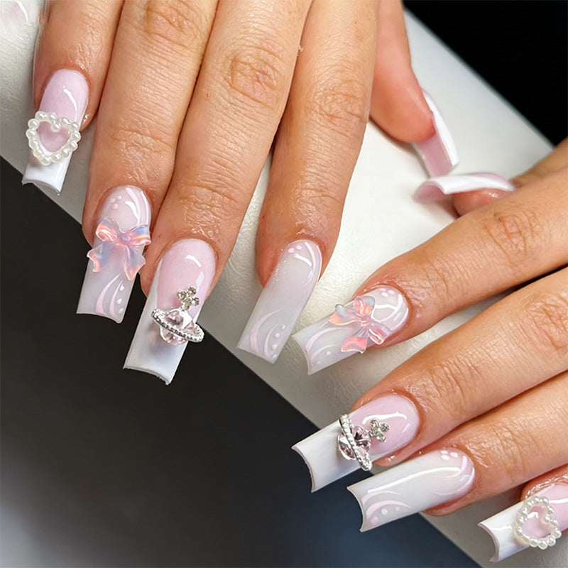 Artificial nails with delicate embellishments Kalsten