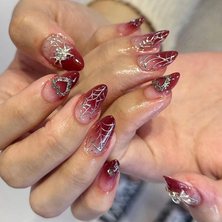 Nail art set with filigree spider web design and glitter accents Kalsten
