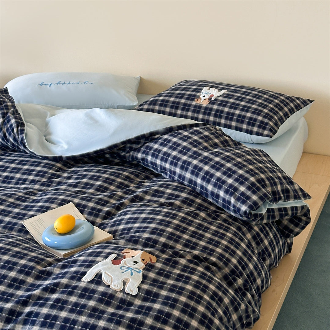 fine striped bed linen set with embroidered cat motif and soft cotton satin