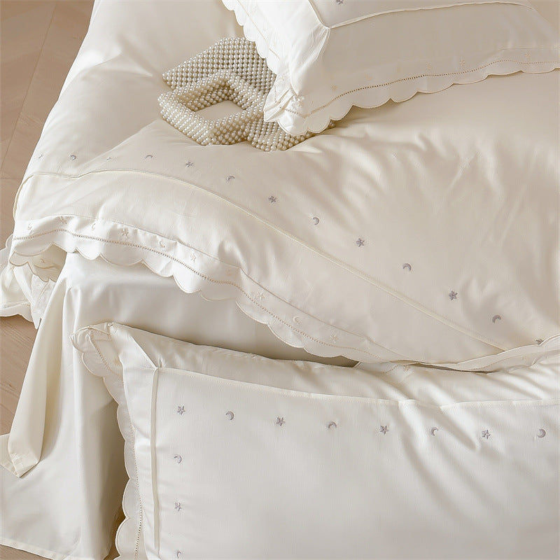 Bedding set made of cotton satin with fine star embroidery and wave hem
