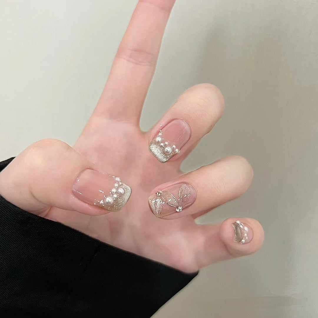 Elegant artificial nails with pearl decorations and glitter effects Kalsten