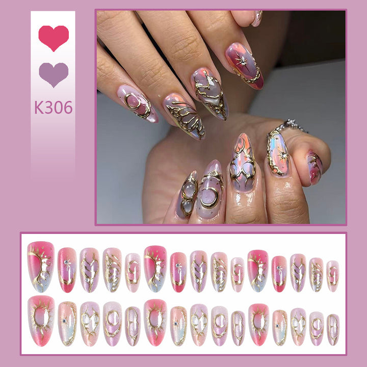 Acrylic nail set with glamorous 3D designs and elegant gold accents Kalsten