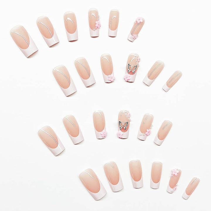 Artificial nail set with playful 3D flowers and glitter accents Kalsten
