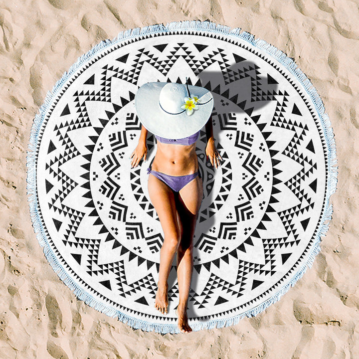 Round beach towel with tropical leaf print and fringe decoration Kalsten
