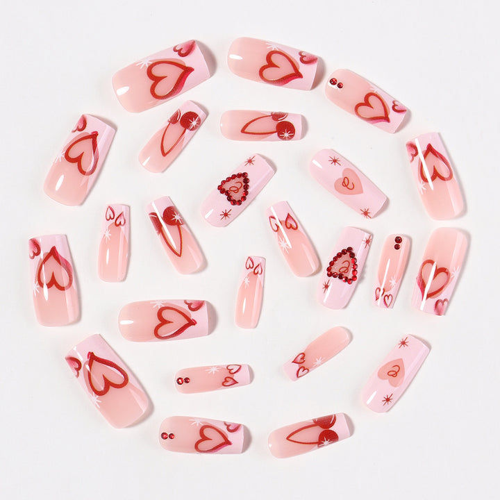 Artificial nail set with romantic heart designs and sparkling rhinestone decorations Kalsten