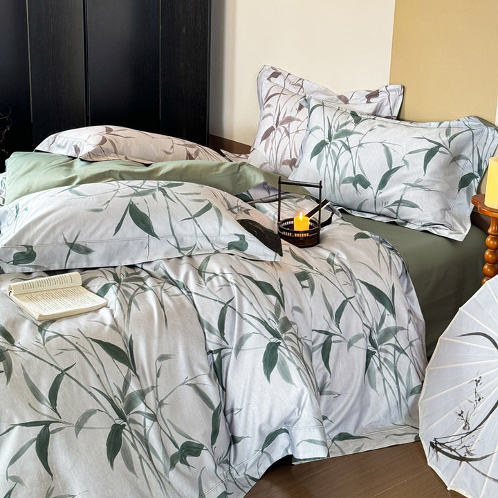 Bedding set made of cotton satin with botanical bamboo leaf print and reversible pillowcases