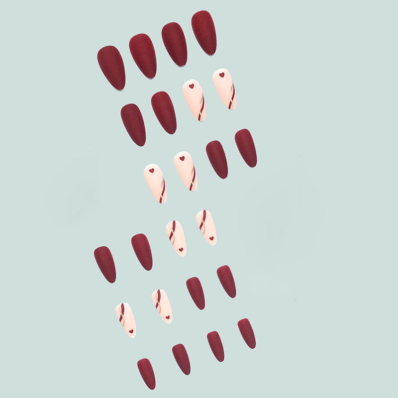 Artful and elegant artificial nails with heart decorations Kalsten
