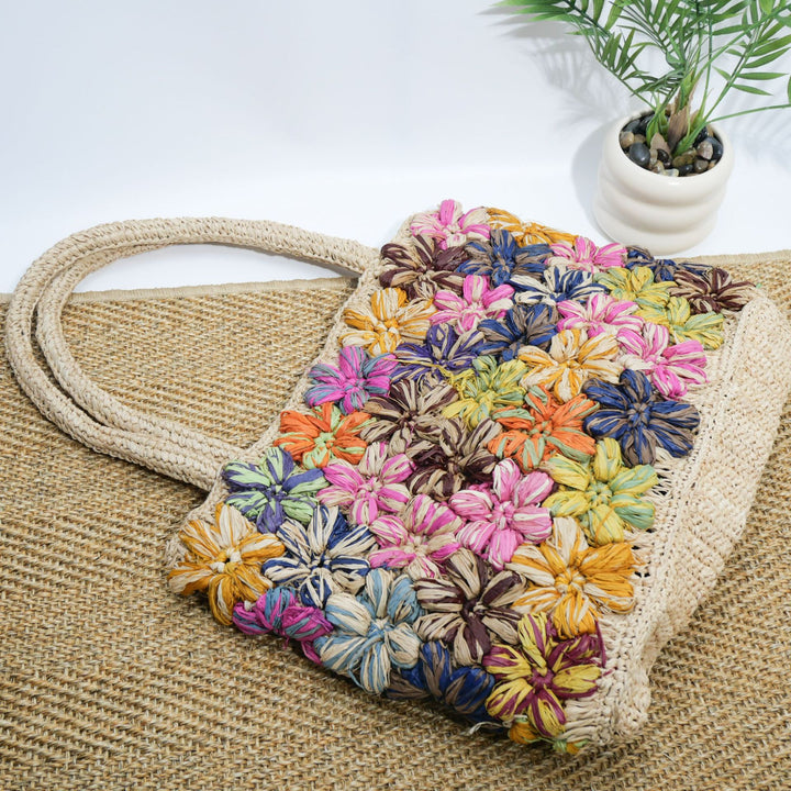 Handcrafted straw bag with floral appliqués Kalsten