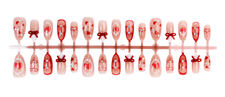 Artificial nail set with cute heart and bow designs Kalsten