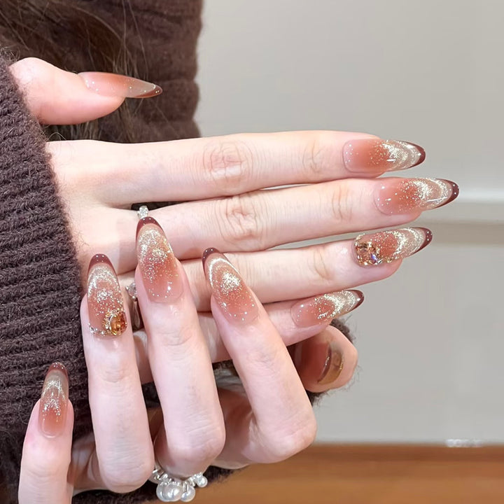 Glamorous art nails with glitter and stone accents Kalsten
