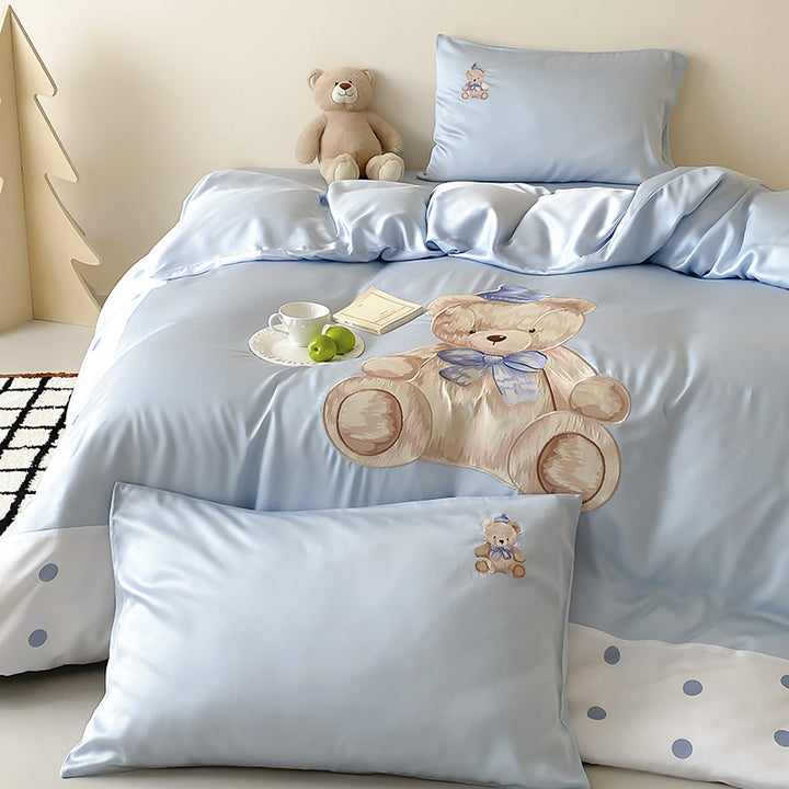 Reversible satin bedding set for children with a large watercolor teddy, polka dot border, and silky-matte finish