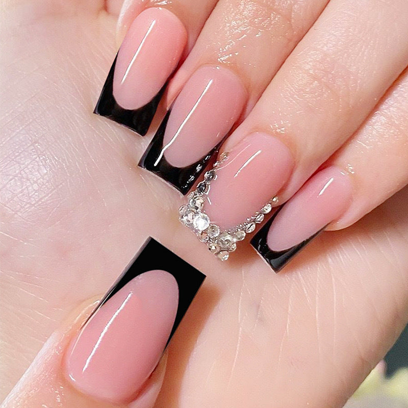 Artificial nail set with luxurious French design and sparkling rhinestone decorations Kalsten
