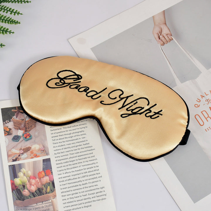 Unisex embroidered contoured sleep mask with decorative text embroidery and adjustable elastic band Kalsten