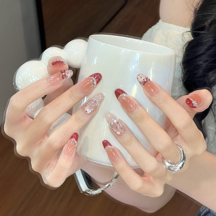 Artistic Stiletto Nail Enhancements with Decorative Accents