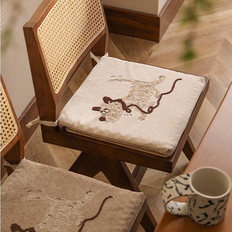 Padded seat cushion with embroidered dog motif and ties Kalsten