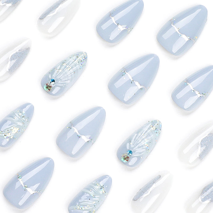 Artful stiletto nails with elegant glitter and floral design Kalsten