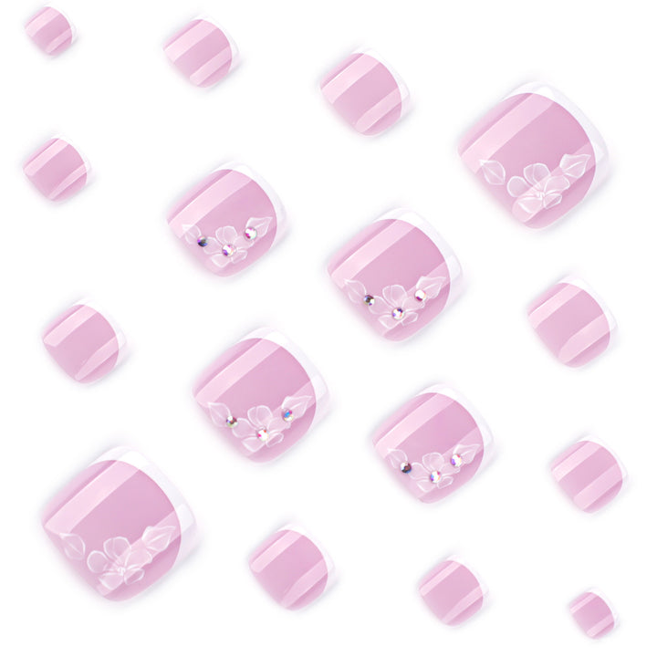 Artful toenail design with delicate flowers and glitter embellishment Kalsten
