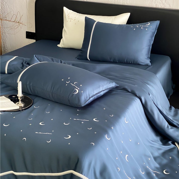 Silky shiny satin bed linen set with subtle moon and star motif