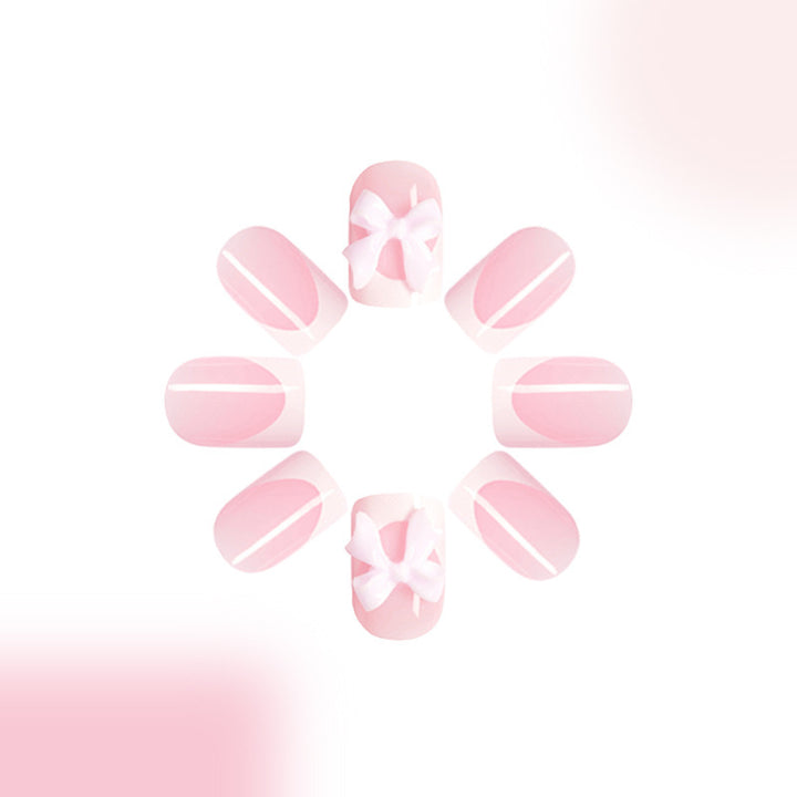 Acrylic nail set with playful bow design Kalsten