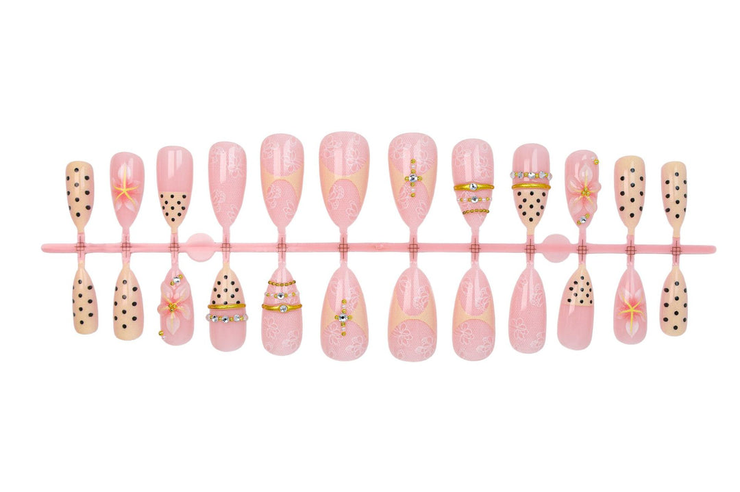 Artificial nail set with delicate floral patterns and elegant accents Kalsten