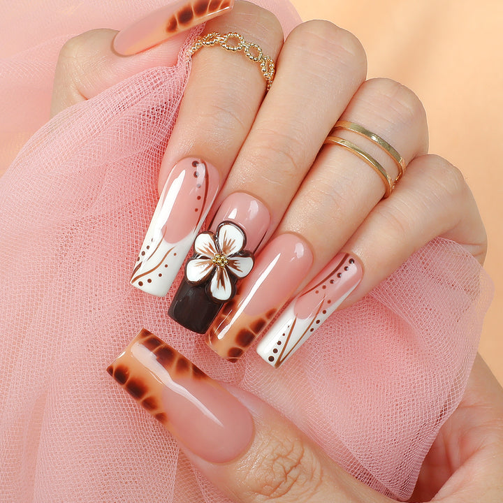 Creative nail art set with delicate floral and glitter accents Kalsten