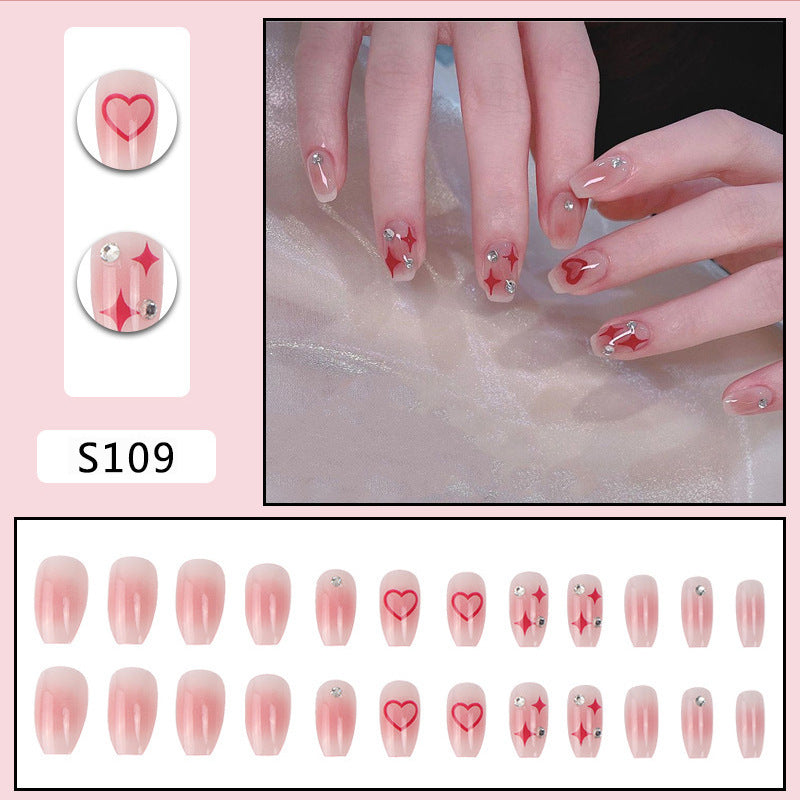 Nail art set with sparkling rhinestone details and heart motifs Kalsten