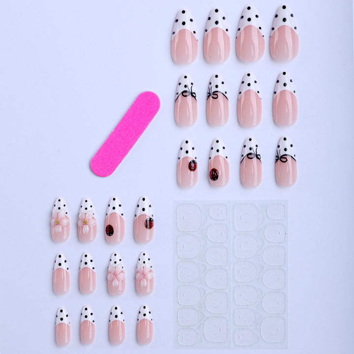 Artificial nail art with floral and playful accents Kalsten