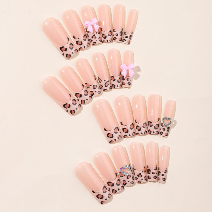 Creative nail set with leopard pattern and bow accents Kalsten