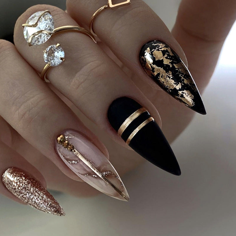 Glamorous stiletto nails with golden accents Kalsten