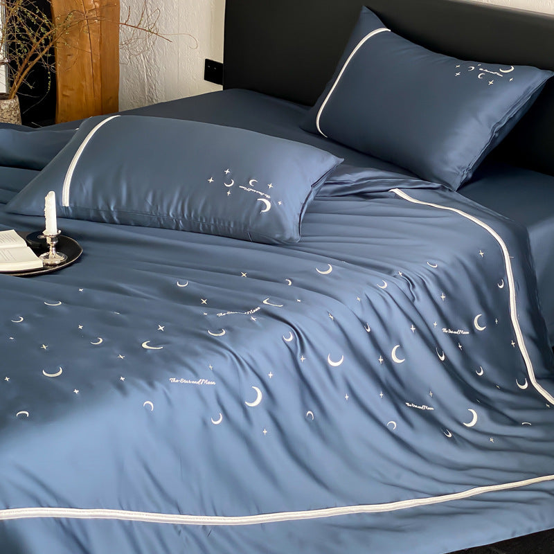 Silky shiny satin bed linen set with subtle moon and star motif