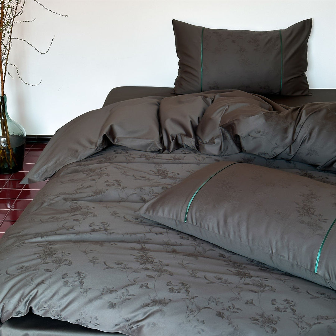 Luxurious satin bedding with floral jacquard and contrast piping