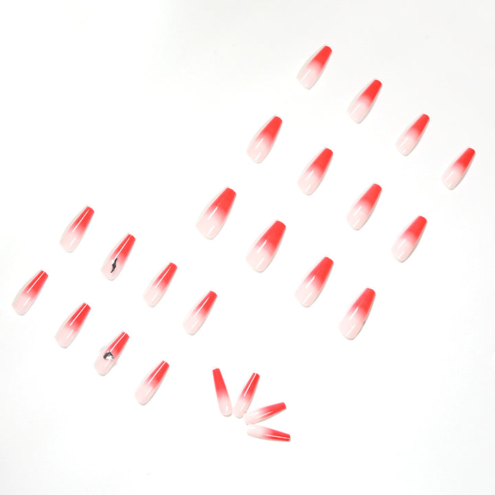 Artful stiletto nails with elegant gradient and rhinestone embellishment Kalsten