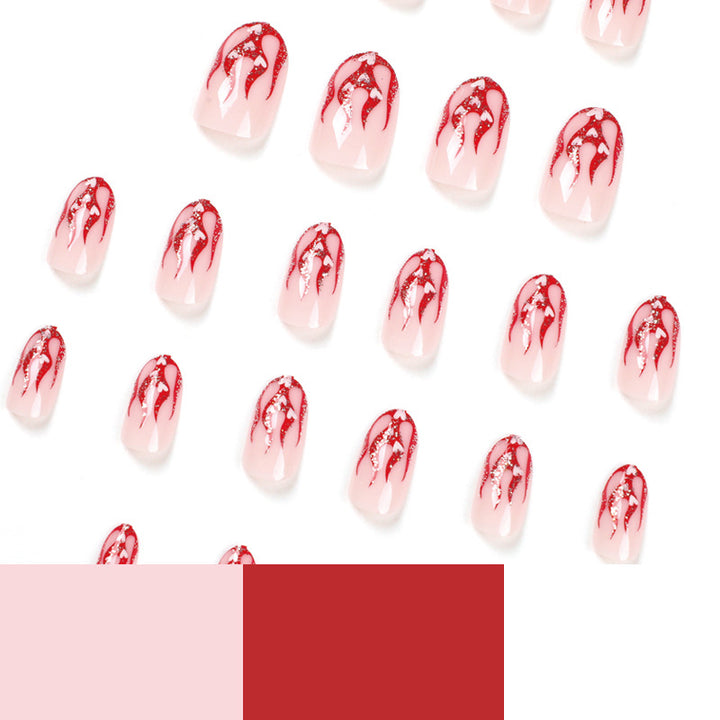 Artificial nail art with romantic heart and flame design Kalsten