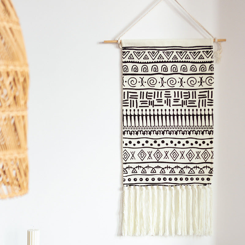 Woven cotton blend wall hanging with graphic ethnic pattern and long fringes Kalsten